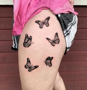 Black Ink Trible Butterfly Thigh Tattoo