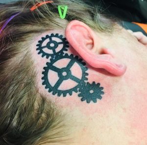 10 Black Ink Tiny Gear Sprocket Tattoo Behind the Ear