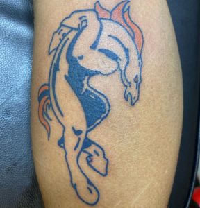 11 Amazing Blue Ink Designed Broncos Tattoo on Arm