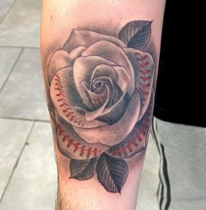 11 Floral Baseball Stiches Tattoo on Forearm