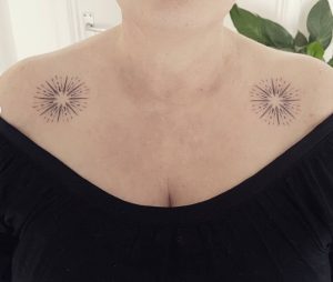 dot & linework Sunburst Tattoo on chest