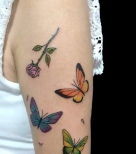 12 Mullti Color Inked Pink Rose with Yallow Blue Green Color Butterflies Tattoo for Beautiful Female on Arm