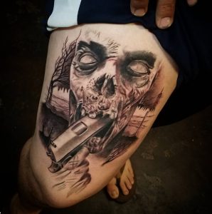 12 Outstanding Black Inked 1911 Pistol targeted to Shoot on Zombie Mouth Tattoo on Thigh