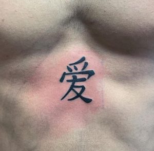 12 Simple Kanji Tattoo on Belly