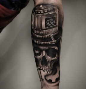 12 Trimendous Solid Black Ink Fixed Gear Denver Skull Tattoo on Forearm