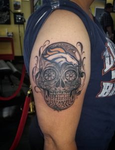13 Broncos In Skull Tattoo on Half Arm