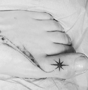 13 Dark Ink Star Toe Tattoo