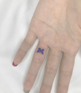 13 Incredible Blue Inked Minimal Butterfly Tattoo on Finger Front Side