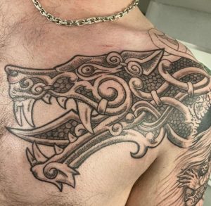 14 Incredible Viking Fenrir Sketch Tattoo Covering Chest to Shoulder