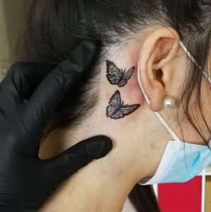 14 So Cute Black Butterfly Faminine Tattoo on Behind the Ear