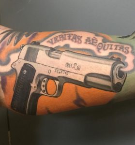 15 Stunning Color Inked 1911 Pisto Tattoo with Quote on Arm Bicep