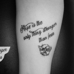 16 Black Ink Hunger Games Mockingjay Tattoo Quotes on Forearm