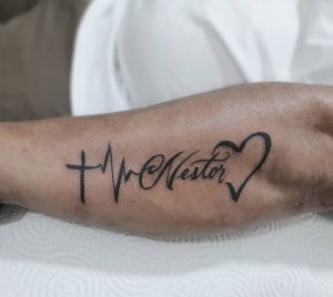 16 Outstanding Heart Shape with Cross and Name Tattoo on Arm