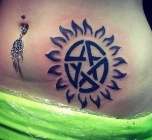 Sunburst Tattoo with Star on Belly