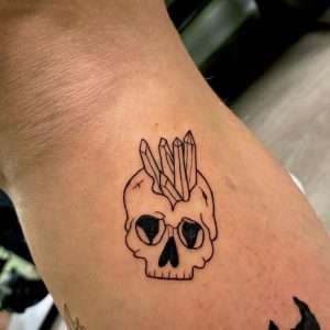 17 Fine Black Line Tiny Crystall Tattoo with Skull Behind the Arm