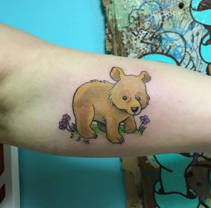 18 Lovely Yallow Ink Baby Bear Cub Tattoo on Arm Bicep