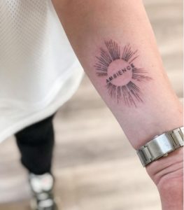 Ambience Sunburst Tattoo Design on Forearm