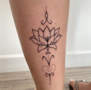 19 Beautiful Black Line with Dot Art Lotous Tattoo on Lower Back leg