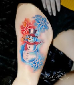 2 Colorful Snow Tattoo on Thigh