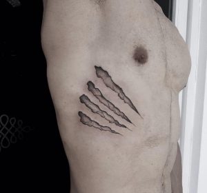 2 Dynamic Black Ink Art Claw Tattoo on Rib