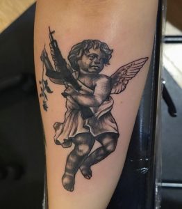 20 Balck Solid Ink Saul Cruz Angle with Wings Tattoo on Front Lower leg