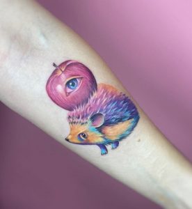 Tattoo with Apple on Forearm