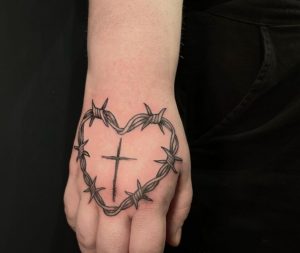 20 Superb Cross inside Barbed Wire Heart Tattoo on Wrist Hand that Next to Upper Fingers