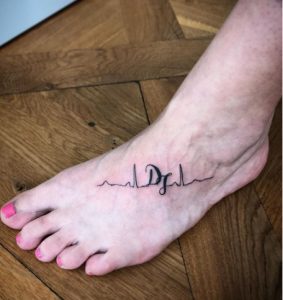 21 Black Ink Pulse Tattoo on Foot