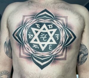 21 gray color Body Suit Tattoo on chest