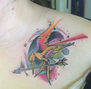 22 Amazing Water Color Ink Mockingjay Flying Birds with Arrow Tattoo on Chest