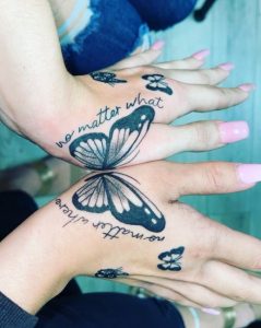 22 Gorgeous Solid Black Inked Butterfly Tattoo with Quote within Both Hands on Thumb Upper Finger