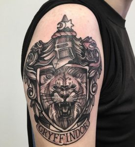 22 Gray Line Work Lion Roaring Gryffindor Tattoo on Half Sleeve