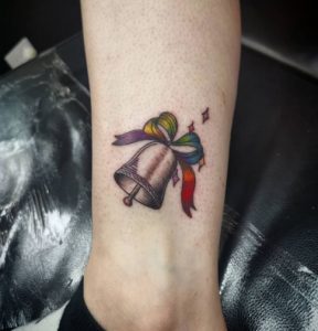 22 Rainbow Tie With Bell Tattoo on Leg