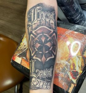 Super gray color Fire Department symbol Tattoo on Forearm