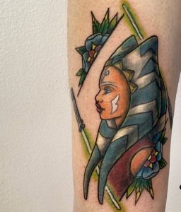 22 Superb Color Inked Small Ahsoka Tattoo with Her Sword on Hand