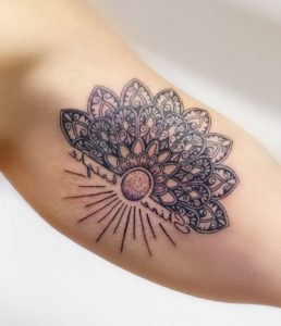 Superb Sunburst Tattoo with Mandala design on half sleeve