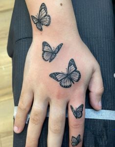 23 Classic Design Black Inked Butterflies Tattoo for Pretty Girls on Finger