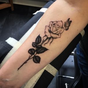 24 Black Gray Ink Designed Rose with Butterfly Tattoo on Half Hand
