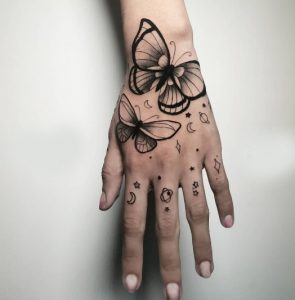 24 Black Inked Butterfly Tattoo for Galaxy Lover on Upper Fingers