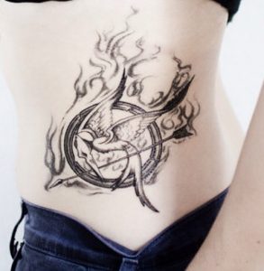 25 Gorgeous Gray Ink Mockingjay Fire Birds Tattoo in Circle on Hip