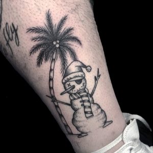 25 Incredible Black Ink Line Snowman Tattoo with Coconat Tree on Leg
