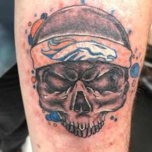 26 Broncos in Furious Skull Tattoo on Hand