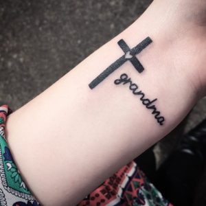 3 Solid Black Color Inked Small Heart in Cross with Missing Persone Name Tattoo on Next to Wrist Hand