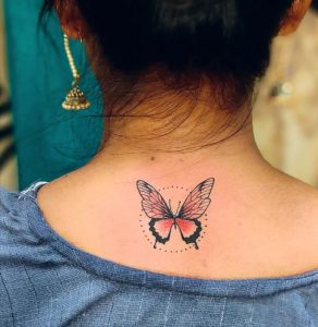 30 Fade Color Inked Butterfly Tattoo on Bellow Backside of Neck