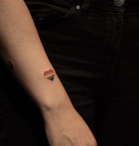 31 Lovely Rainbow Love Tattoo on Forearm