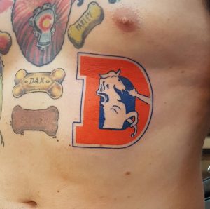 32 Denver Broncos Tattoo on Rib