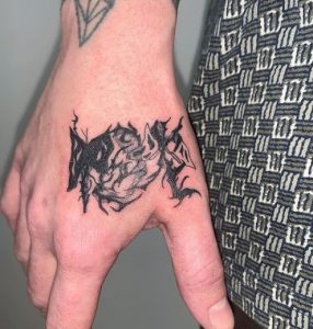 32 Outstanding Black Color Inked Butterfly Thorns Tattoo Next to Fingers
