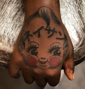 33 Kanji Tattoo with Babay Face on Wrist Hand