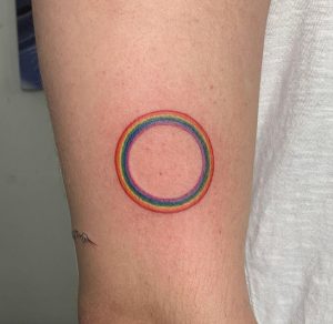 38 Circular Rainbow Tattoo Beside the Arm