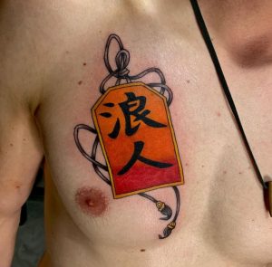 39 Super Ink Kanji Tattoo on Chest